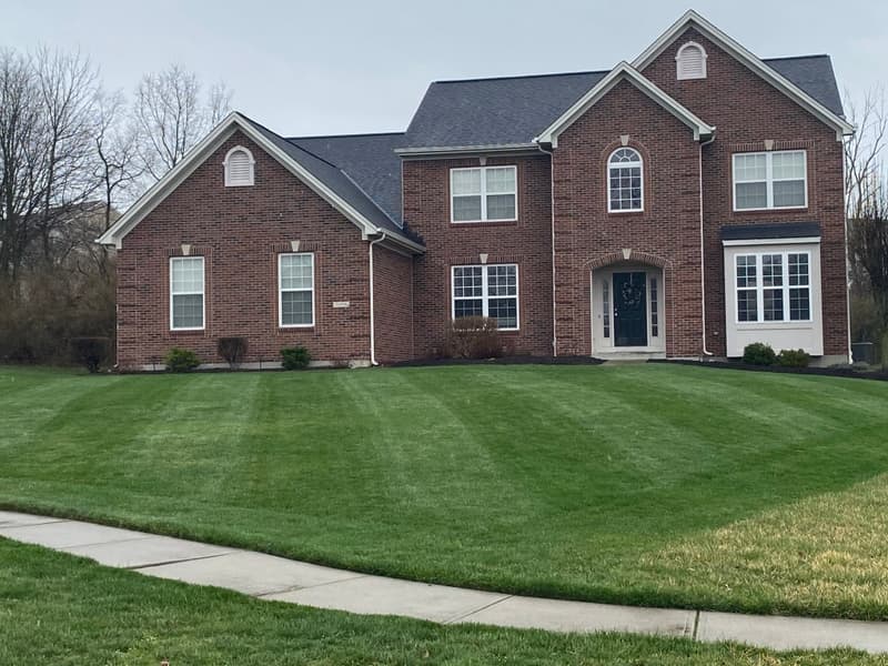 An evenly striped front lawn